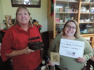 Volunteer Deb Powell, left, and Project Curator Kristie Dobbins, right, work on the collection at the Territorial Capital Museum. Kristie Dobbins' position is funded by a grant through Freedom's Frontier National Heritage Area.