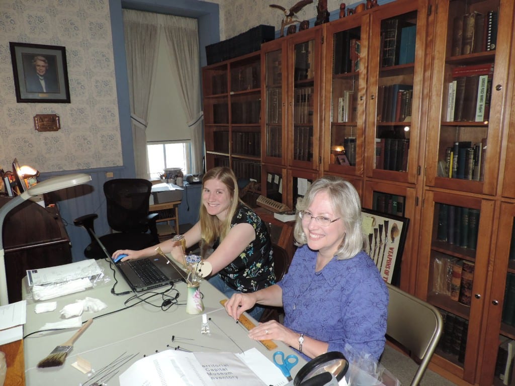 Gina (on right) inventoried our hatpin collection with Rebecca.