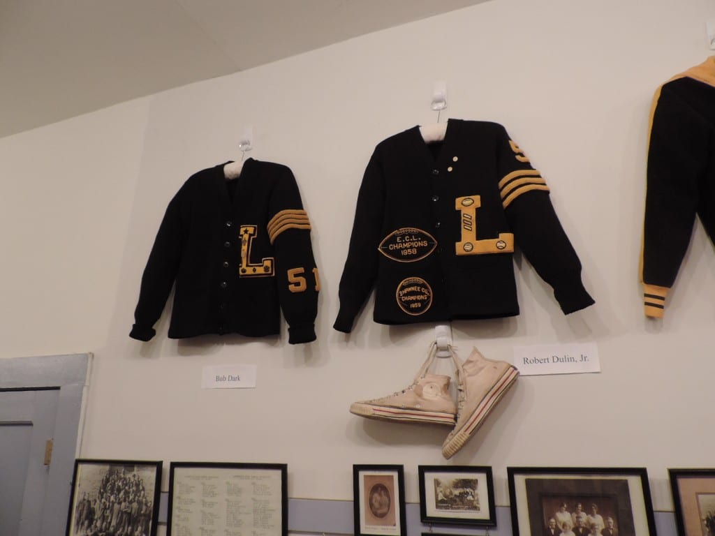 Letter sweaters of Bob Dark, left, and Robert Dulin, Jr., right. Plus Dulin's high school basketball sneakers!